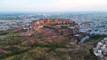 Jodhpur, Rajasthan, India - 11.10.2025 : Aerial view of Mehrangarh Fort and hills and beautiful blue cityscape.