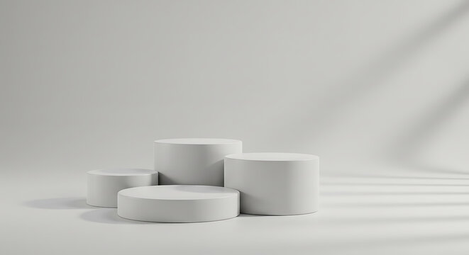 Four white round podiums isolated on white background for product display, a minimal, modern display platform (dais/pedestal) for product or presentation visuals