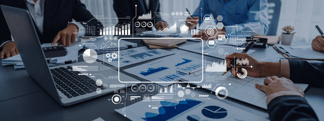 A professional business meeting showcasing a diverse group of people analyzing data with graphs and charts, enhancing strategic decision-making through technology and teamwork. Trope