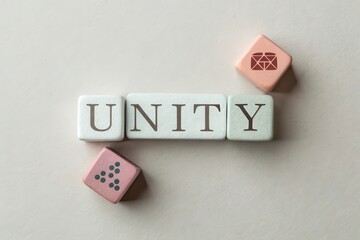 Cubes Arranged To Spell UNITY Against a Plain Background