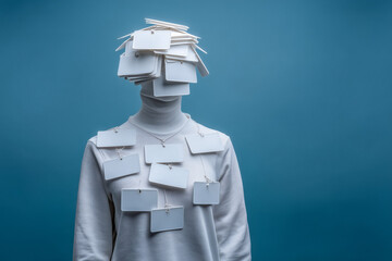 Confused individual overwhelmed by numerous blank name tags symbolizing identity crisis or information overload, seeking clarity and definition.
