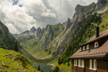 Mountain landscape with a lake and a guesthouse