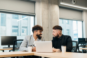 Diverse business professionals collaborating in modern office