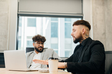 Diverse business professionals discussing project during office meeting