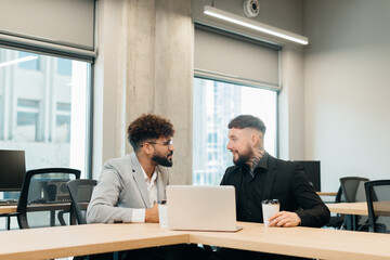 Business professionals discussing ideas in modern office