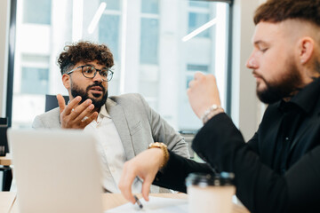 Business professionals discussing strategy during office meeting