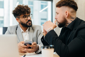 Diverse businessmen discussing new ideas in meeting