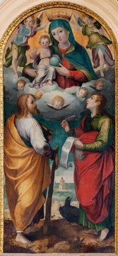 SALERNO, ITALY - OCTOBER 6, 2025: The painting of Madonna with the apostles St. John and Jude Thaddeus in the Cathedral of St. Matthew by unknown artist. 