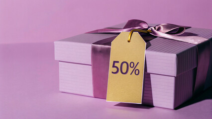 Christmas Gift with Discount Tag on Purple Background