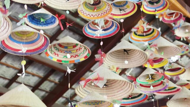 Garlands made from Vietnamese national hats are hanging from the ceiling.