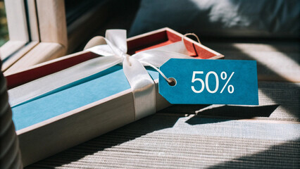 Elegant Present with Ribbon and Price Tag