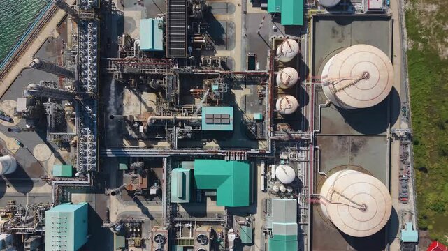 Top-down aerial view of Petronas Methanol Plant in Labuan&rsquo;s Rancha-Rancha Industrial Estate, Malaysia. The complex layout of tanks, pipelines, and structures symbolizes industrial energy production
