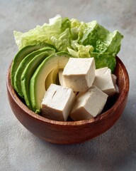 Healthy Tofu and Avocado Salad Bowl with Fresh Greens.