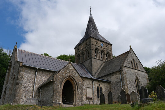 All Saints' Norman Church and Broach Spire in East Meon Village, Hampshire