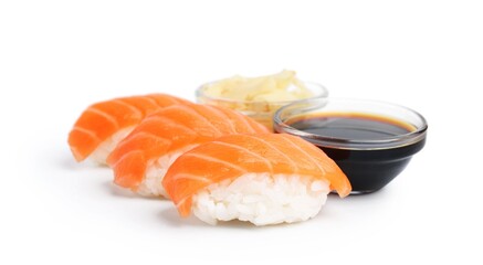 Delicious nigiri sushi with salmon, soy sauce and ginger isolated on white