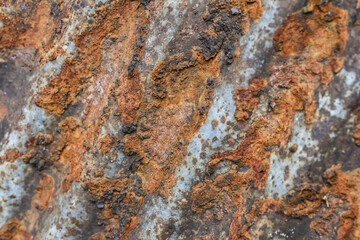 Abstract background of rough metal texture with severe rust and corrosion. surface shows signs of decay and aging, creating worn and gritty pattern
