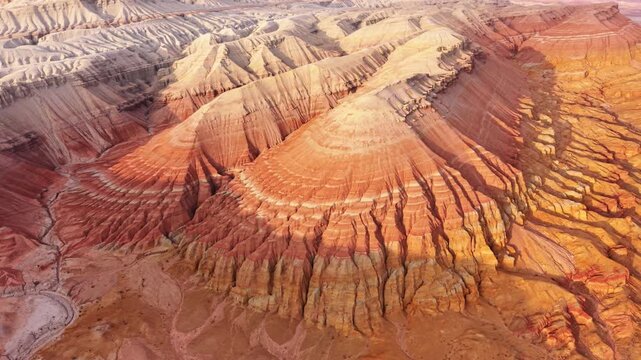 Colorful layered sedimentary mountains with geological erosion pattern of Altyn Emel national park in Kazakhstan