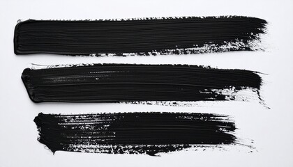 Three horizontal black brush strokes with varied texture on white background