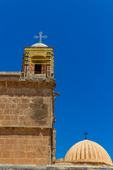 Bell Tower and dome of Deyrulzafaran monastery in Mardin Turkey