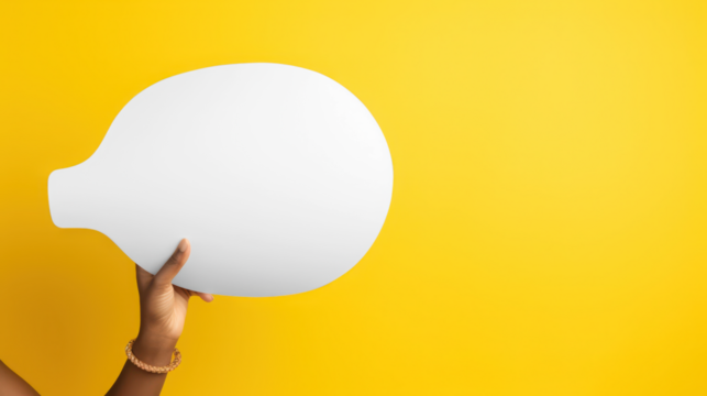 Transparent a hand holds a large, white, abstract speech bubble shape against a vibrant yellow background mockup 