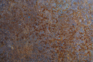 Grunge rusted metal texture, rust and oxidized metal background, closeup, top view. Old metal iron panel