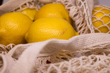 Eco Lifestyle with Lemons in Reusable Mesh Bag – Zero Waste Flat Lay on White Background