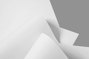 Chaotically folded sheets of white paper in black and white as a background.