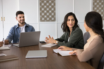 Group of young professionals participating in meeting or briefing