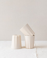 Handmade ceramic coffee and espresso cups made in the slip casting method of pottery