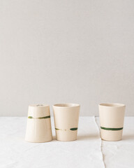 Handmade ceramic coffee and espresso cups made in the slip casting method of pottery