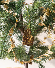 Handmade porcelain Christmas ornaments on a Christmas tree 
