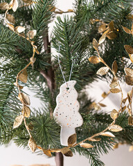 Handmade porcelain Christmas ornaments on a Christmas tree 