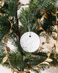 Handmade porcelain Christmas ornaments on a Christmas tree 