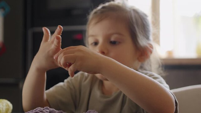 Kids engaging in playful craft by shaping bright slime carefully