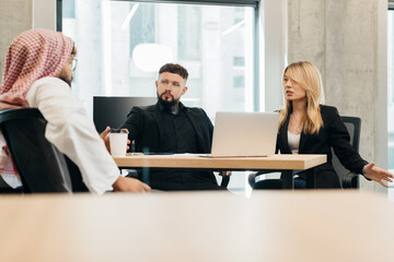 Diverse business team collaborating during office meeting