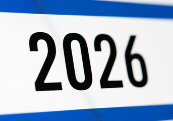 The year 2026 in black numbers on a white background with blue stripes