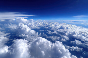 Clouds and blue sky above the horizon during daylight from an airplane view point
