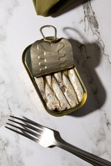 Canned sardines isolated on kitchen countertop