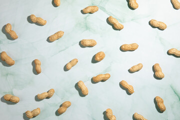 Peanuts isolated on kitchen countertop, dried fruit background.