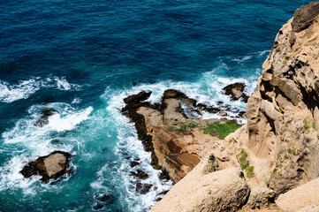 waves crashing on rocks