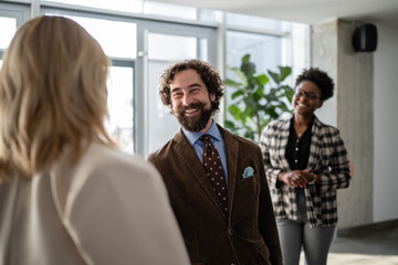 Diverse business team smiling at office meeting