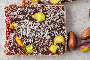  Turkish delight cezerye with pistachio or hazelnut on vintage  background. Cezerye, a traditional dessert from the Mersin region
