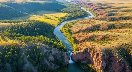 Aerial view of a winding river through a dramatic canyon landscape