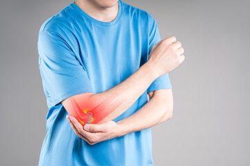Diseases of the elbow joint, bone fracture and inflammation, man suffering from pain in cubit