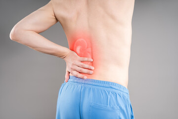 Back pain, kidney stones concept, inflammation and disease, renal discomfort