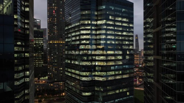 twilight time illumination singapore city financial center office building front aerial panorama 4k 