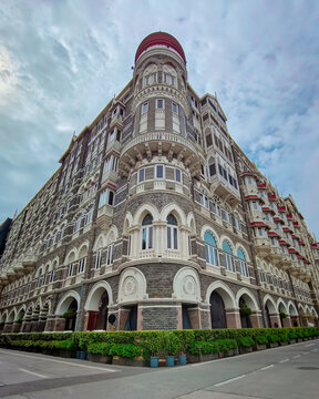 The Taj Mahal Palace Hotel in Mumbai, India, stands as an architectural masterpiece blending Islamic and Renaissance styles. Its arched windows, domes, and detailed stonework exude timeless elegance. 