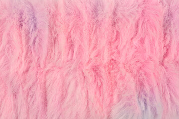 A full frame, overhead shot of a colorful, fluffy, pastel pink and blue faux fur texture