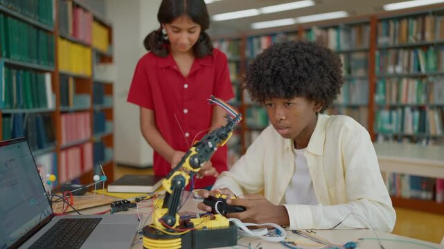 High school students learning and build electronic robot model together for construction project. Innovative technology, Development concept