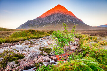 Autumn sunrise at Buachaille Etive Mor, and the Coupall River, Glencoe, Lochaber, Highlands, Scotland, UK.